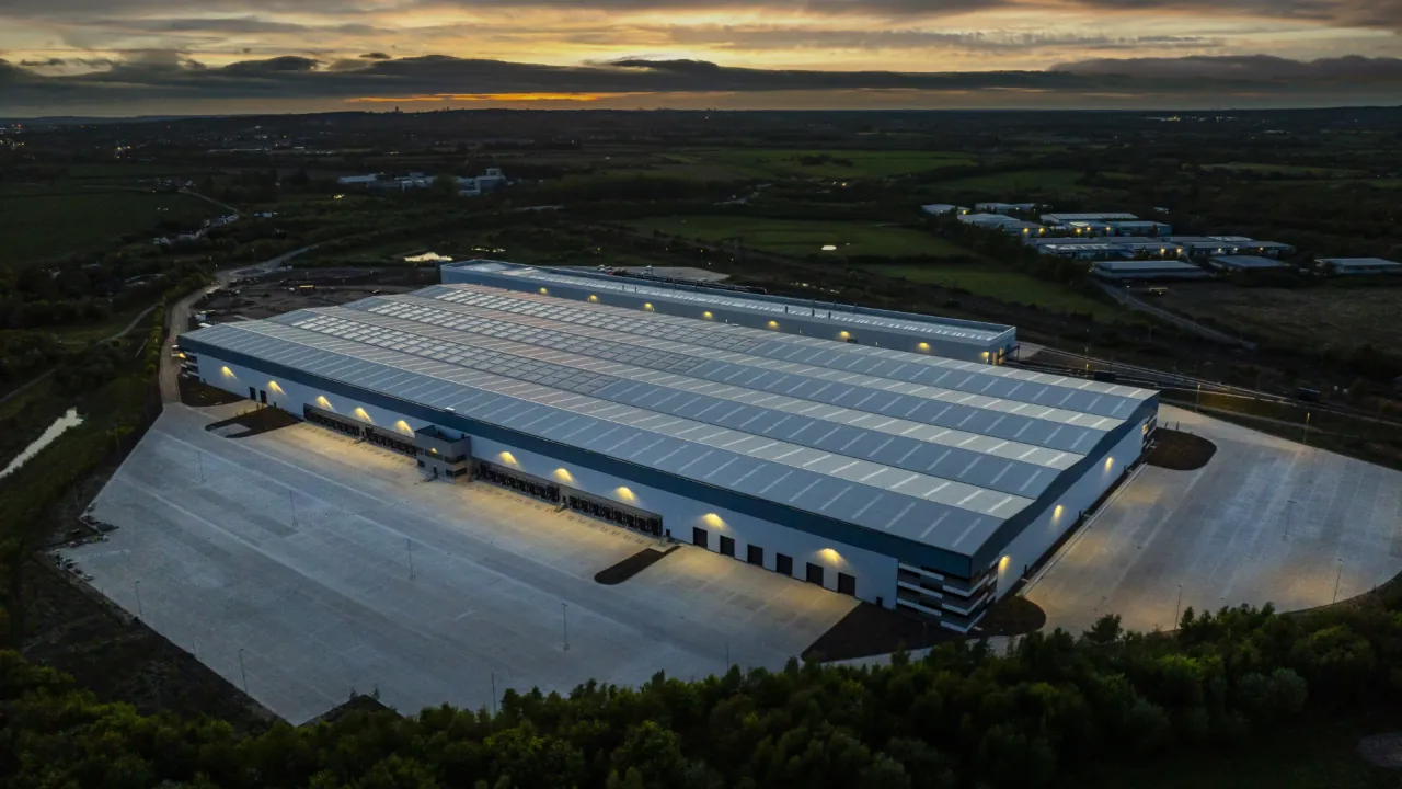 XDock 549 at dusk, lit loading docks and yard seen from above